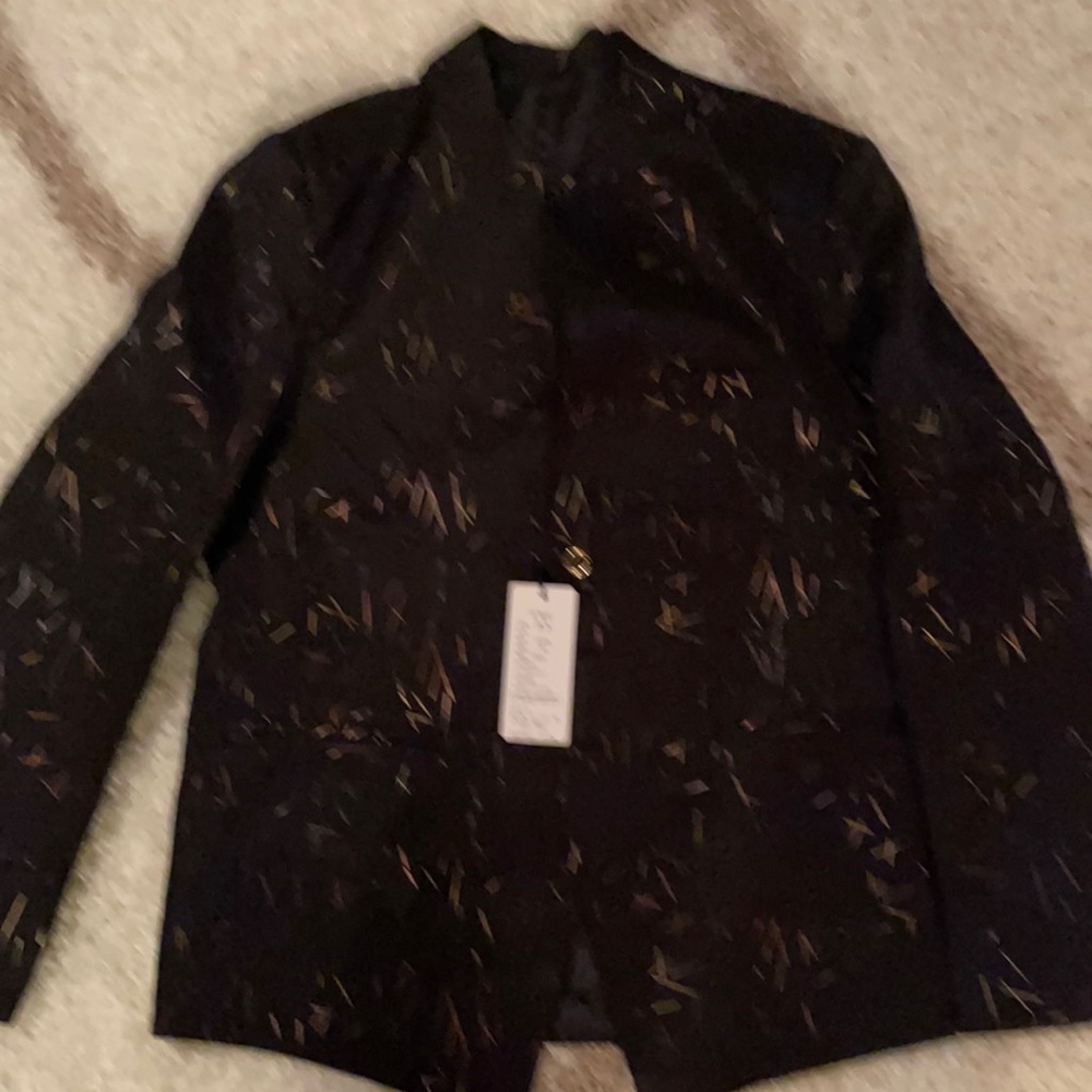 This is a sports dinner jacket  black and gold with gold buttons very sharp.